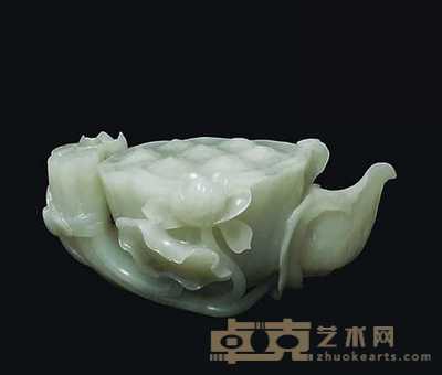 18TH CENTURY A CELADON JADE CARVING OF A LOTUS POD 